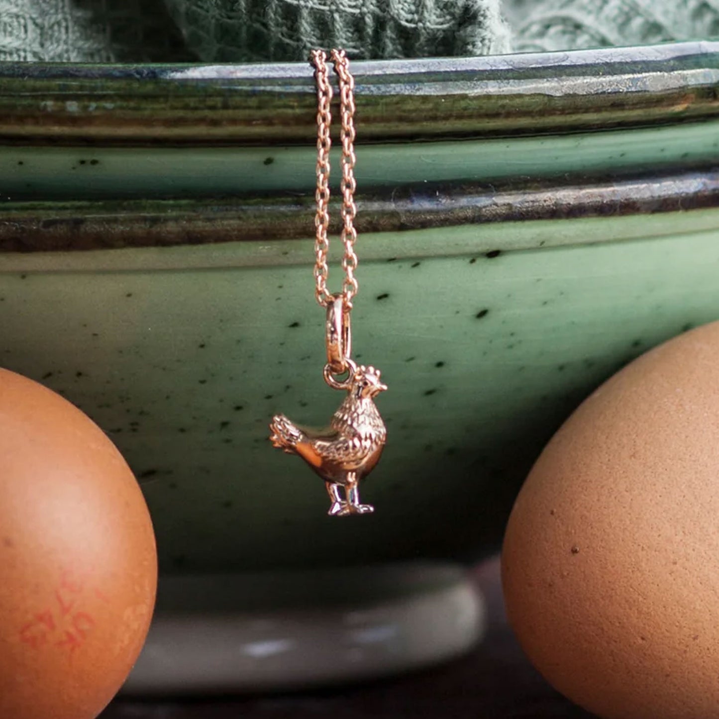 chicken-necklace-hanging-from-a bowl