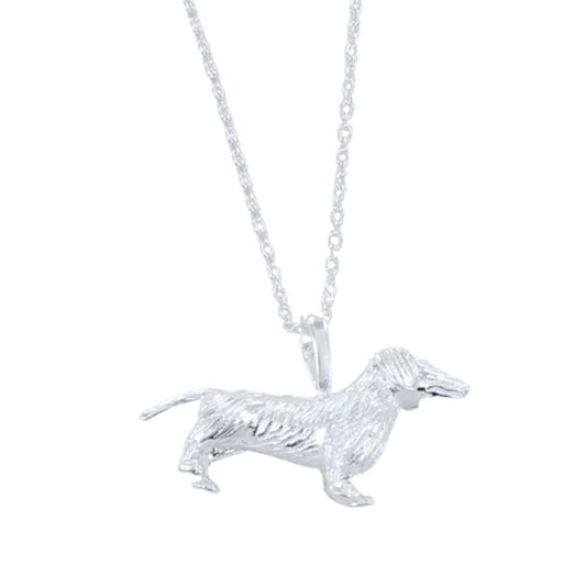 Silver dachshund dog pendant on a chain against a white background