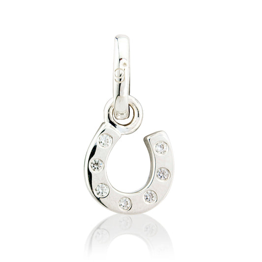 Silver horseshoe pendant with embedded crystals on a white background