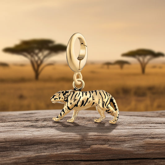 Gold tiger charm on a white background