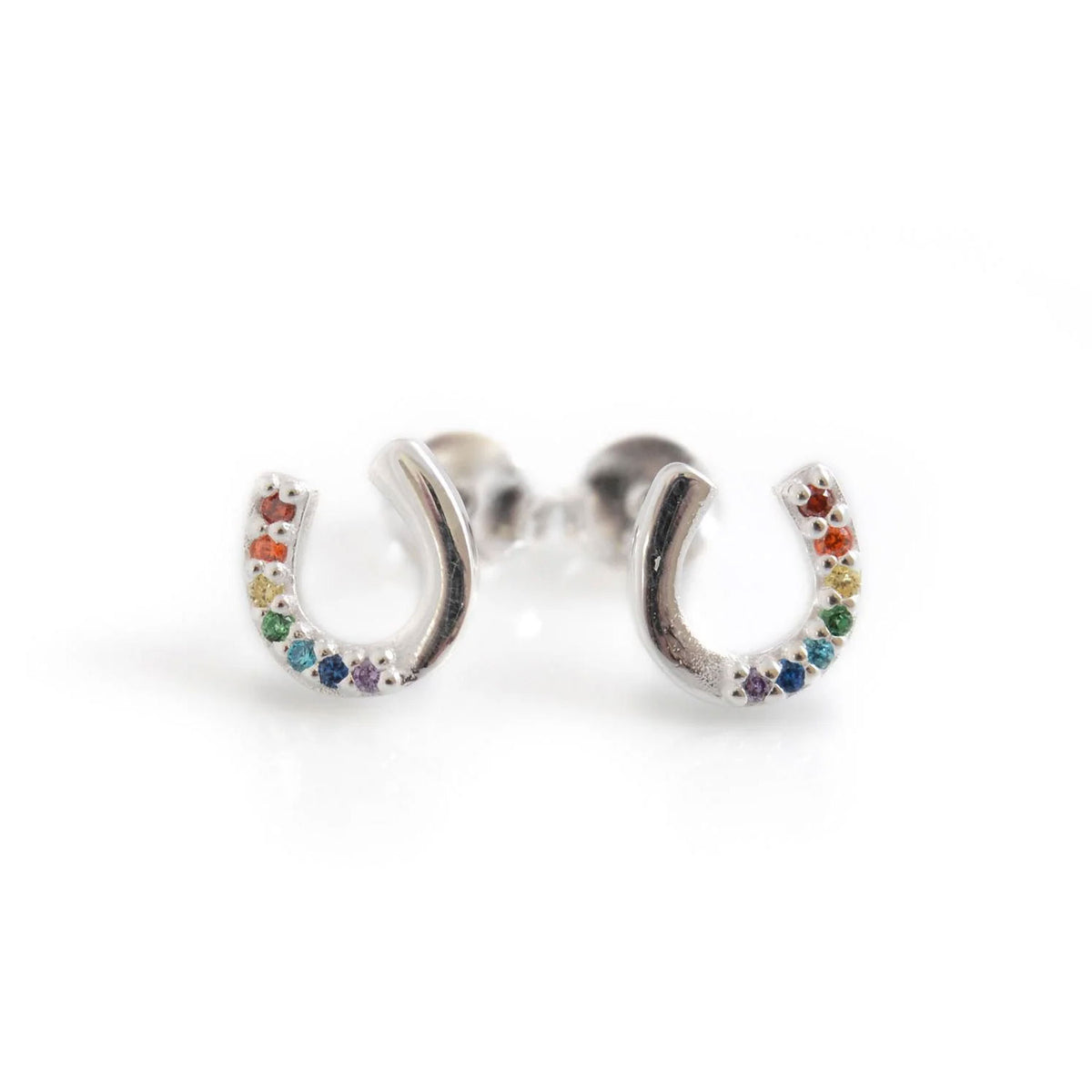 Silver earrings shaped like horseshoes with colorful stones on a white background