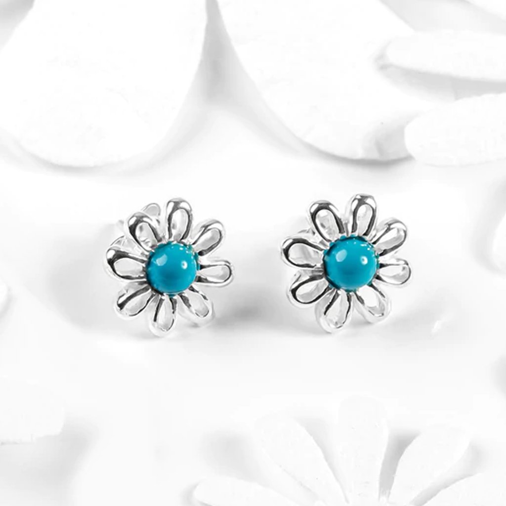 Blue-daisy-sterling-silver-earrings-on-pretty-background