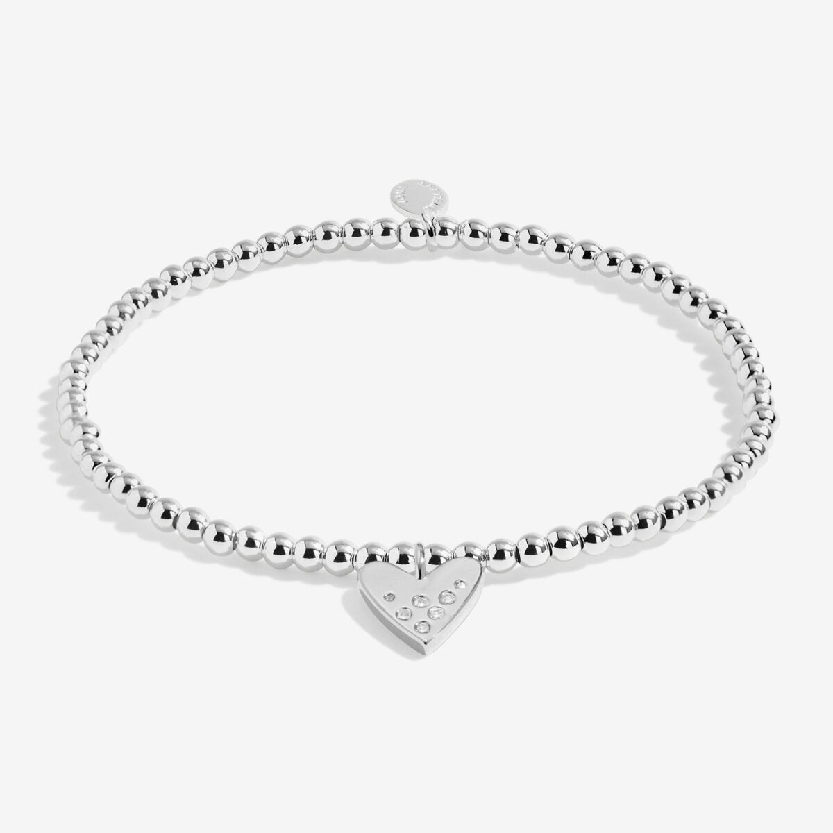 Silver beaded bracelet with a heart-shaped tag on a white background