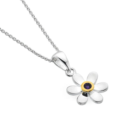 Silver flower-shaped pendant with a purple gemstone on a white background