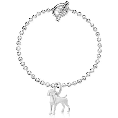 Silver bracelet with a dog charm on a white background