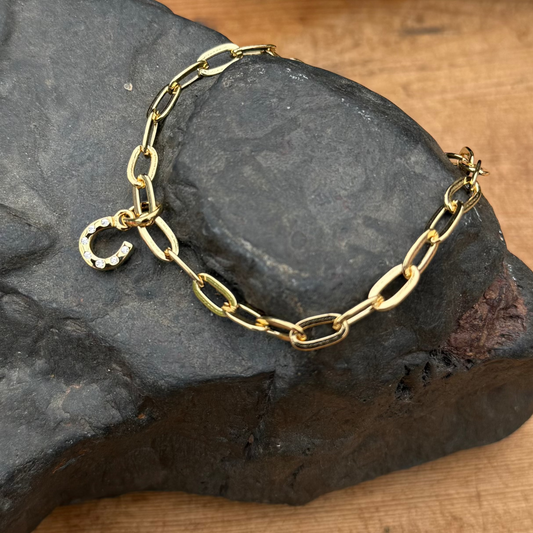 Gold-charm-added-to-a-ink-chain-bracelet-from-cotswold-jewellery