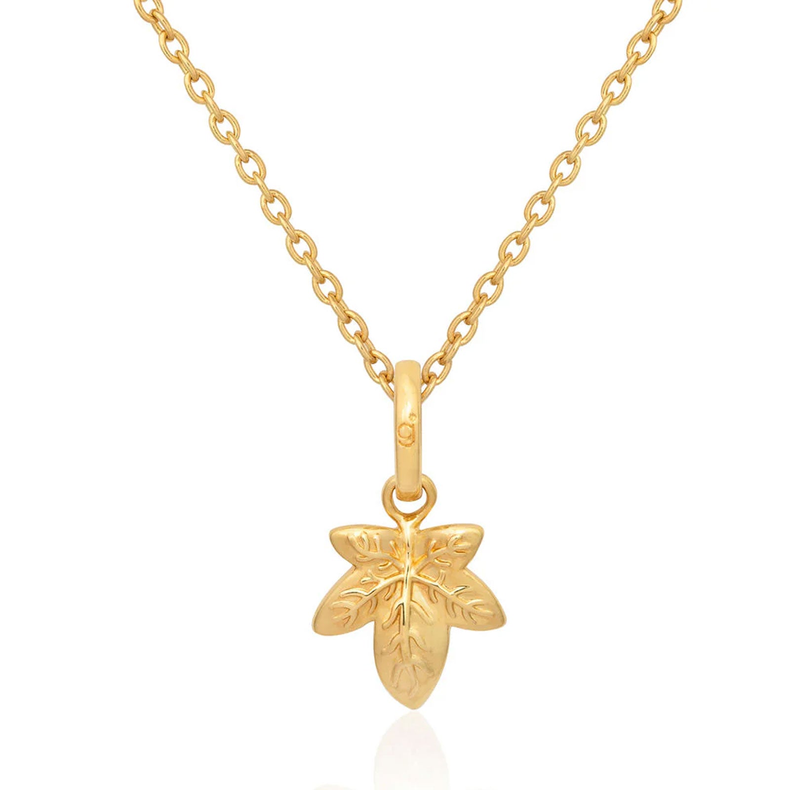 Gold necklace with a leaf-shaped pendant on a white background