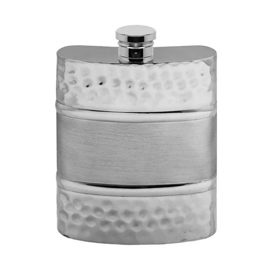 Silver hip flask with textured design on a white background