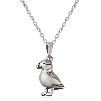 A sterling silver puffin pendant necklace on a matching link chain, shown against a plain white background.