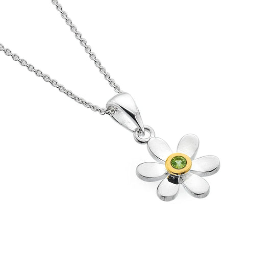 Flower-shaped pendant with a green gemstone on a white background