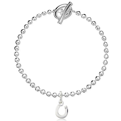 Silver bracelet with a toggle clasp and hook charm on a white background
