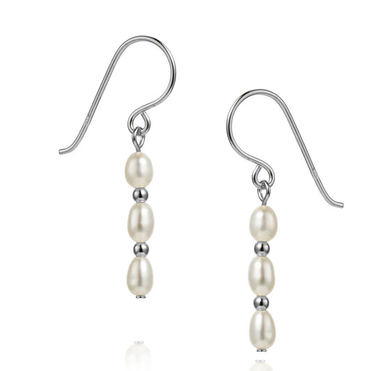 Pearl earrings with silver hooks on a white background