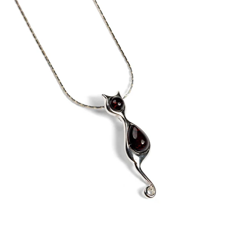 Silver pendant with embedded stones on a white background