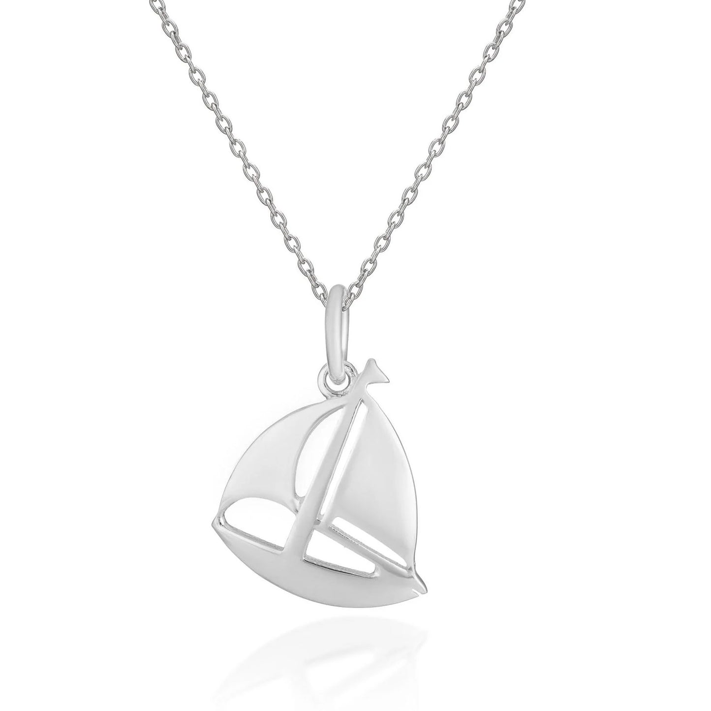 A silver pendant necklace featuring a stylized sailboat charm on a delicate link chain, presented on a clean white background with a soft reflection below.