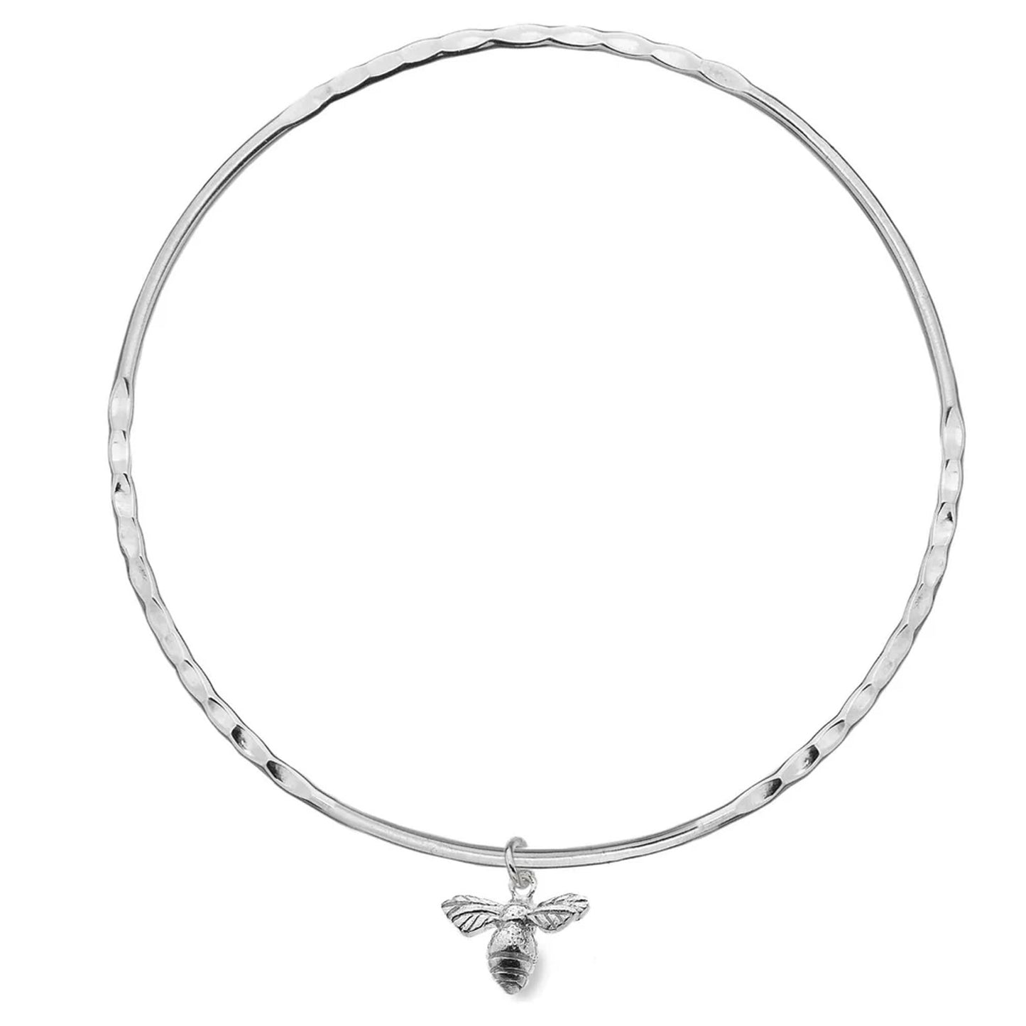 Silver bangle with a bee charm on a white background