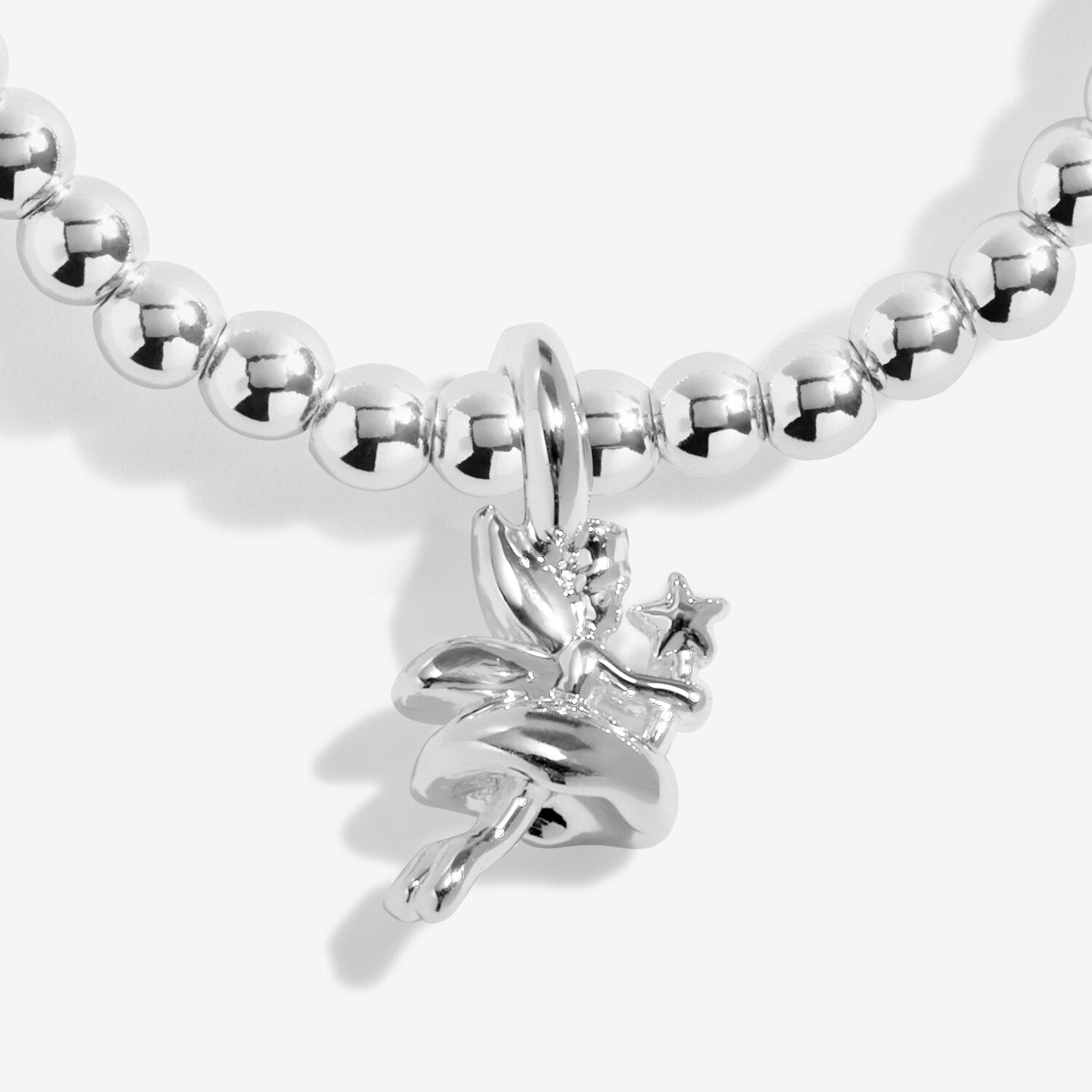 Silver beaded bracelet with a fairy charm on a white background