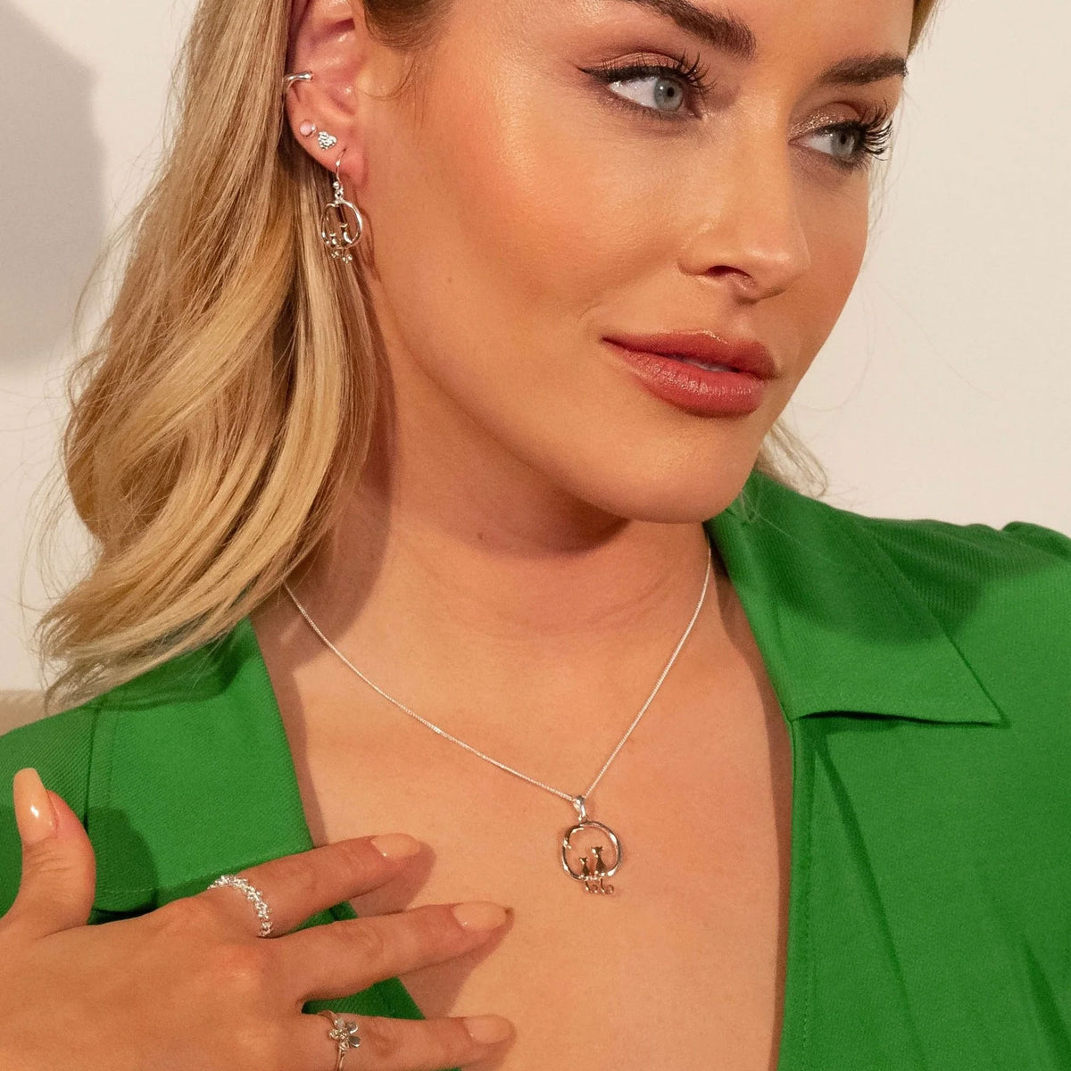 cat necklace being worn by a lady wearing a green dress