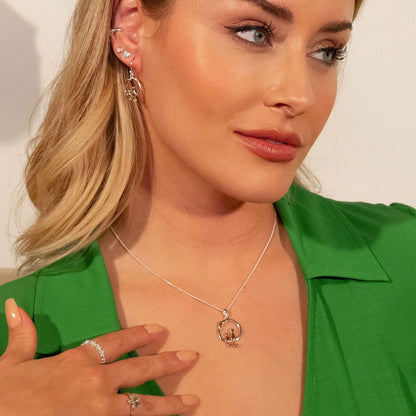 cat necklace being worn by a lady wearing a green dress