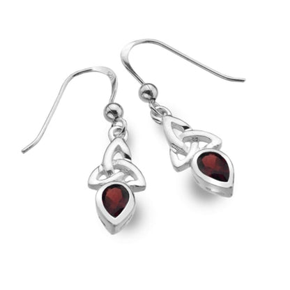 A pair of sterling silver dangle earrings with a Celtic knot design and teardrop-shaped dark red gemstones, shown on a plain white background.