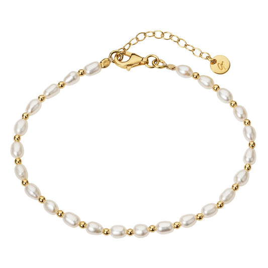 Pearl bracelet with gold accents on a white background