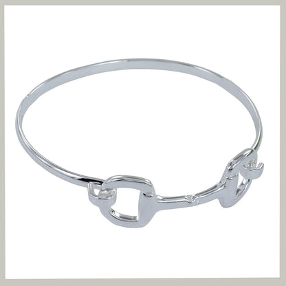 A polished silver-tone silver bangle bracelet with a decorative openwork connector at the front, shown on a plain white background.