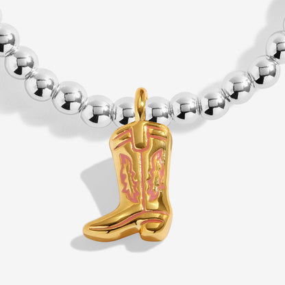 Bracelet with a gold cowboy boot charm on a white background
