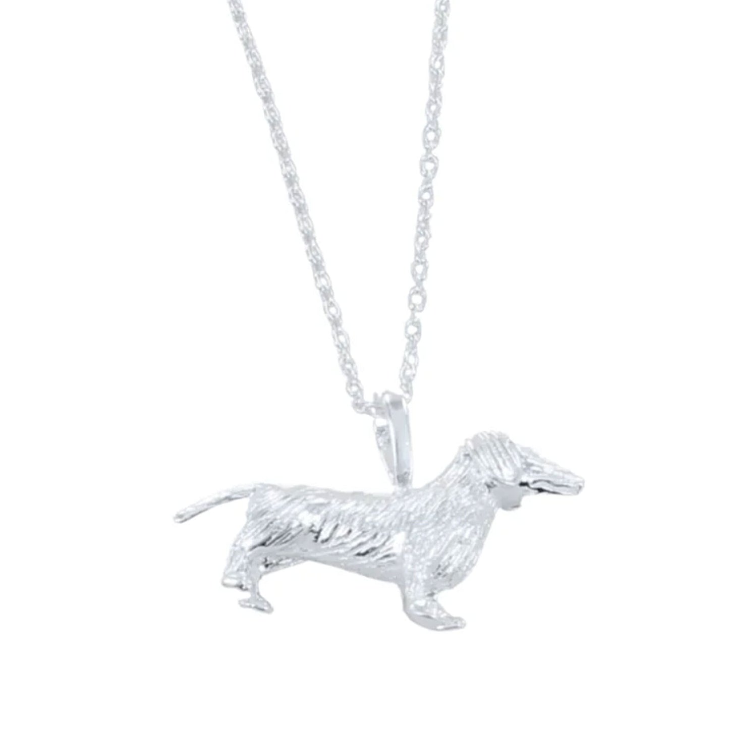 Silver dachshund dog pendant on a chain against a white background