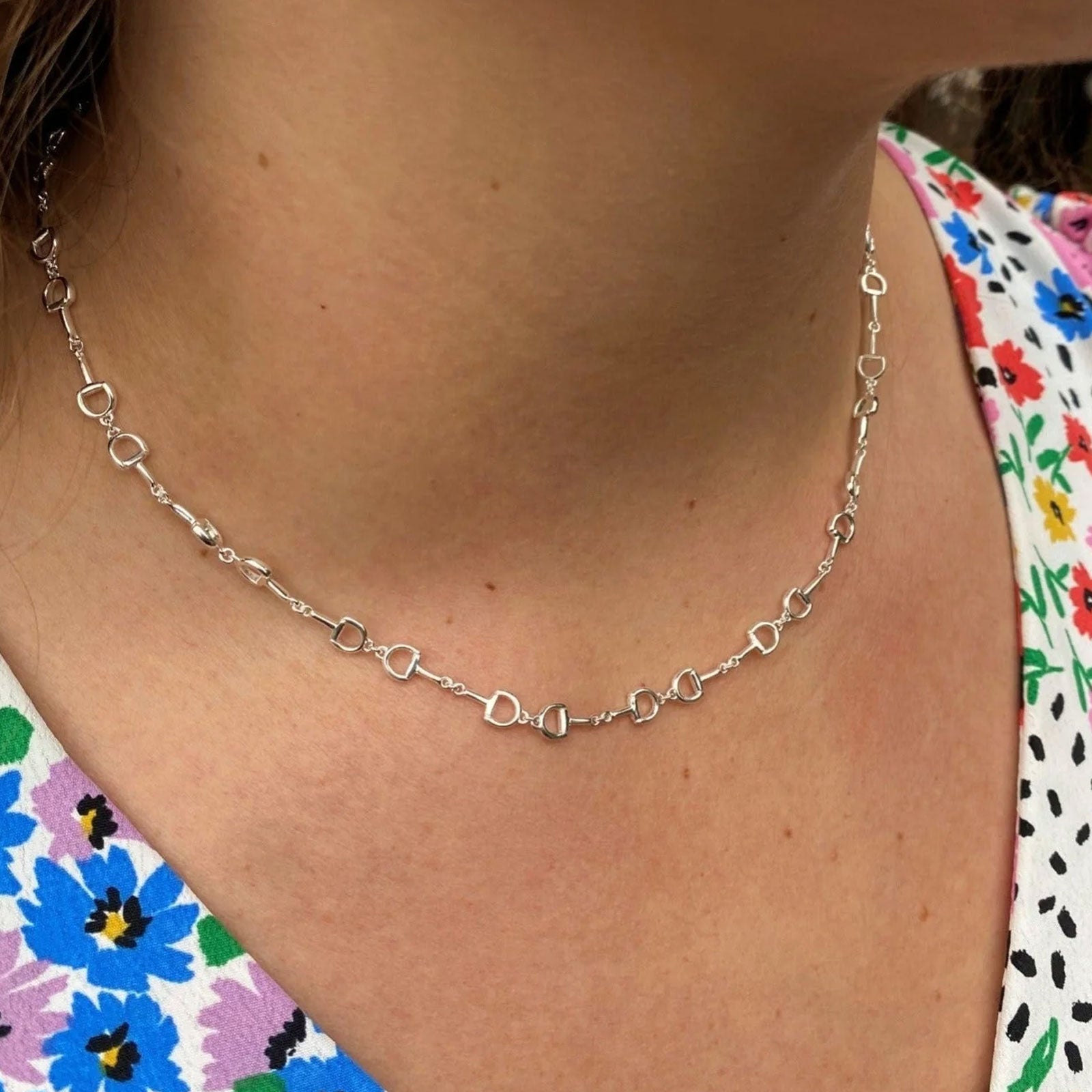 snaffle chain necklace on a ladies neck