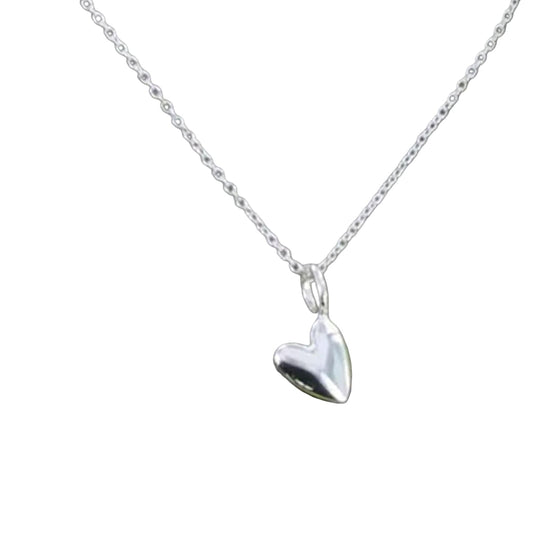 Silver heart-shaped pendant on a chain against a white background