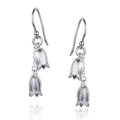 Silver floral earrings on a white background