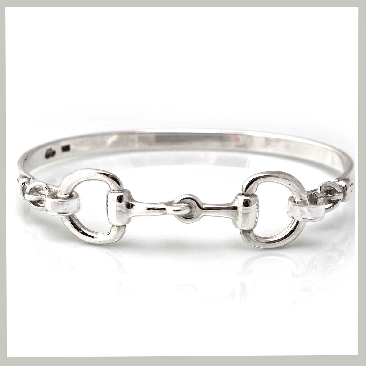 double snaffle bangle with detail on white background