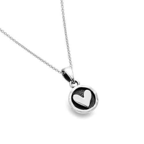 Silver necklace with a heart-shaped pendant on a white background