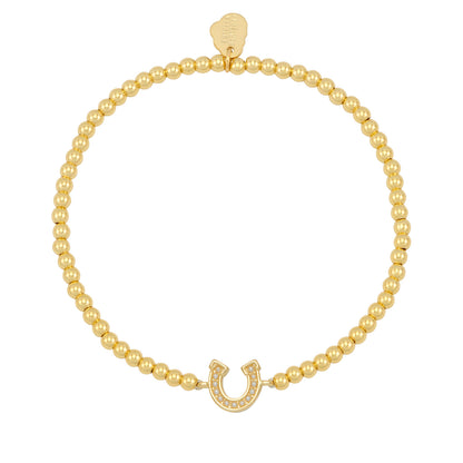 Gold bead bracelet with a horseshoe on a white background