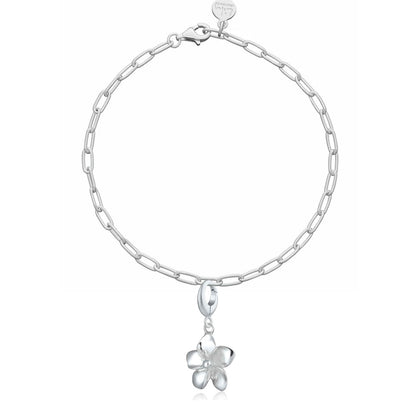 Silver chain bracelet with a flower-shaped charm on a white background