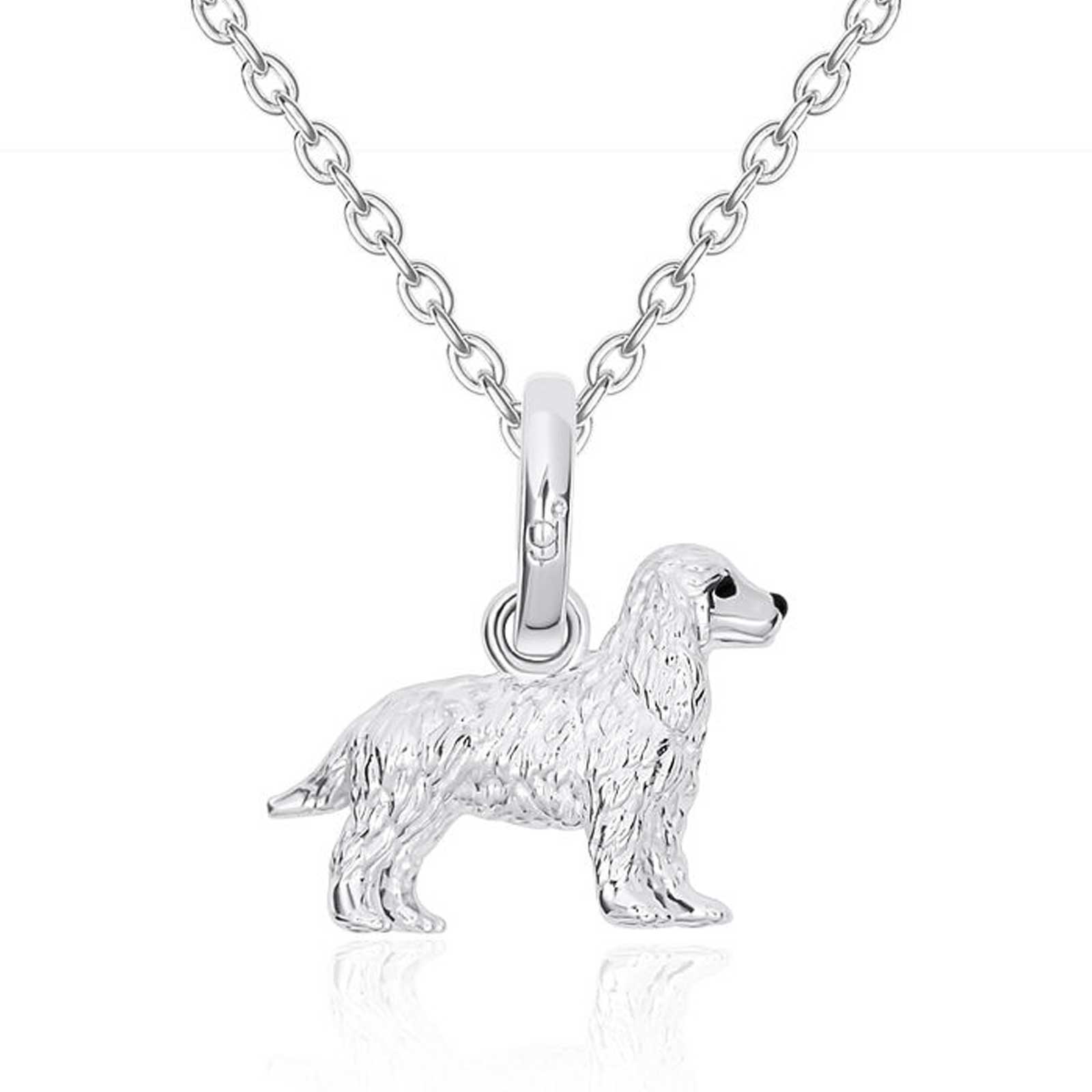Silver dog pendant on a chain against a white background