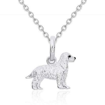 Silver dog pendant on a chain against a white background