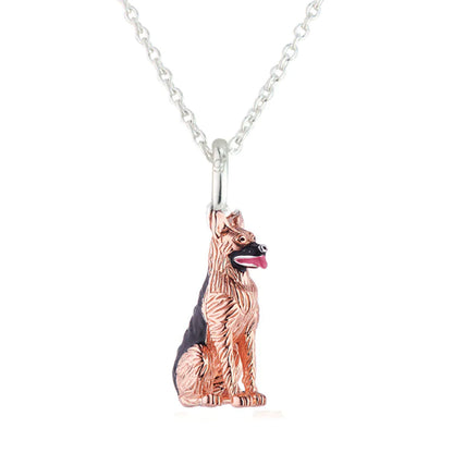 Rose gold dog-shaped pendant on a silver chain against a white background