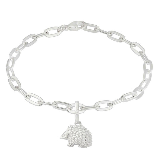 Silver chain bracelet with a hedgehog charm on a white background