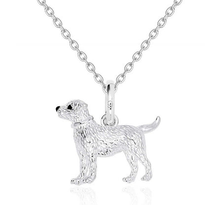 Silver labrador dog-shaped pendant on a chain against a white background