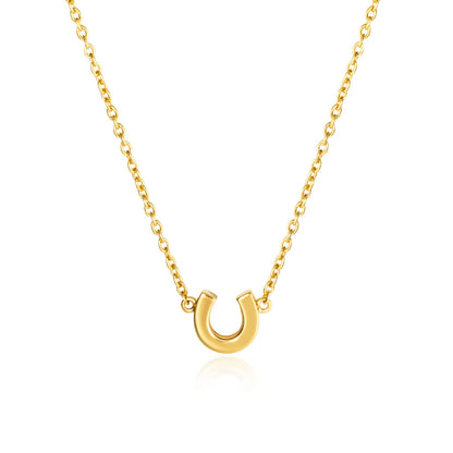 Gold horseshoe necklace on a white background
