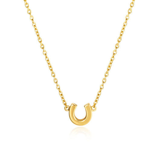 Gold horseshoe necklace on a white background