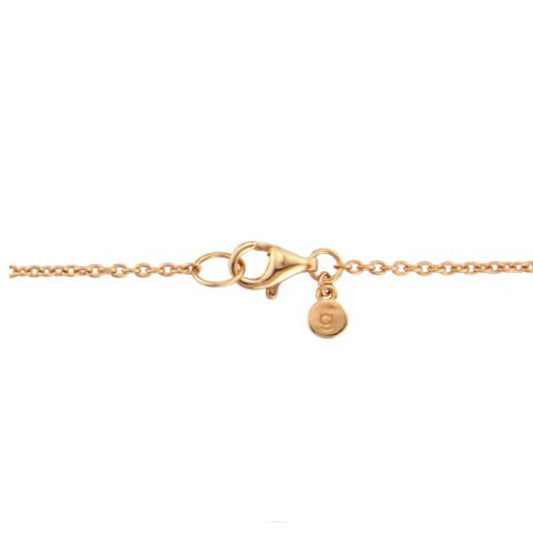 Gold bracelet with a clasp and round charm on a white background