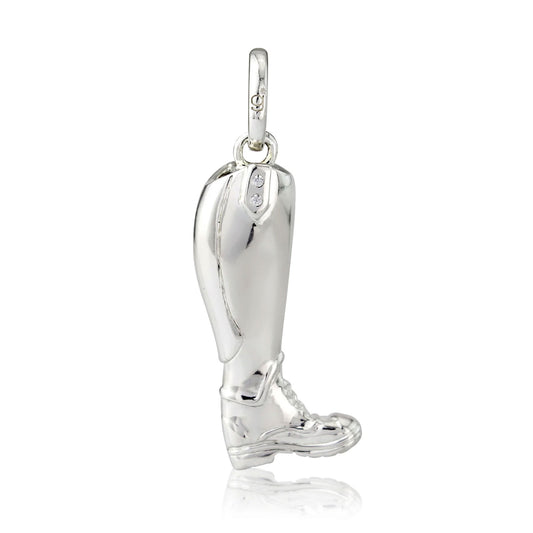 Silver boot-shaped pendant on a white background