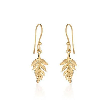 A pair of gold leaf drop earrings with textured leaf pendants and fishhook wires, shown on a clean white background.