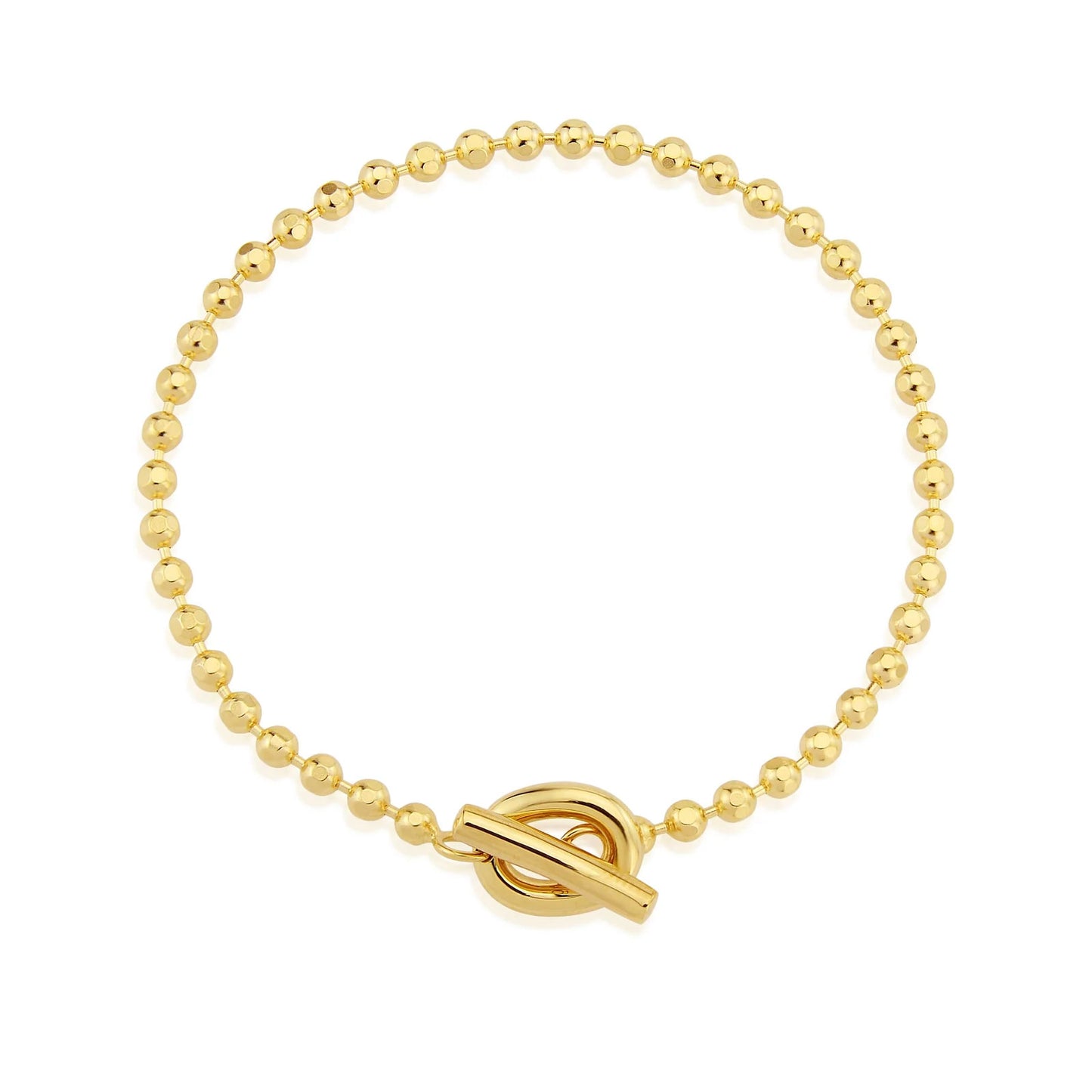 Gold beaded bracelet with a toggle clasp on a white background