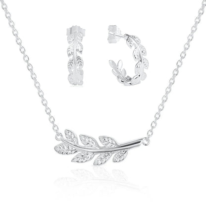 Silver laurel leaf branch necklace and matching laurel leaf hoop earrings, displayed on a clean white background with a soft reflection.
