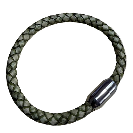 Green braided bracelet on a white background