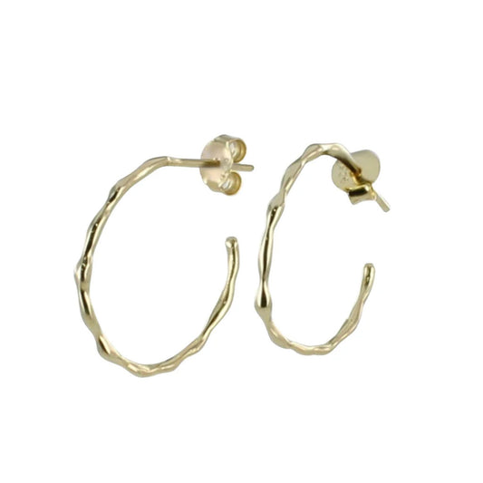 Gold hoop earrings on a white background