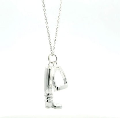 large boot and stirrup necklace with white background