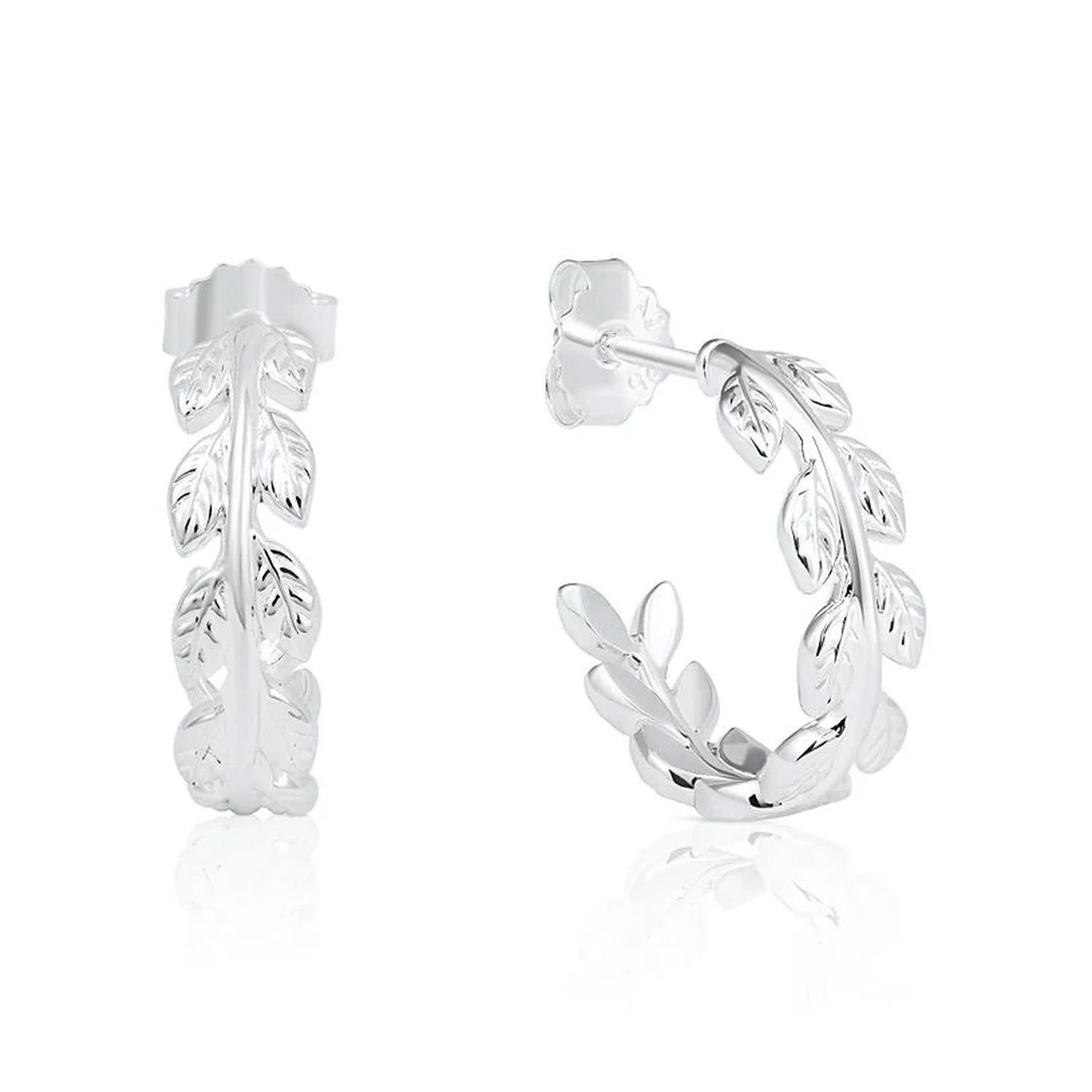 A pair of sterling silver huggie hoop earrings featuring a detailed leafy vine design, shown from the front and side on a clean white background with a subtle reflection.